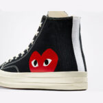 Close-up detail of the CDG Play Converse High Top Black highlighting the red heart logo, premium stitching, and textured black canvas upper.