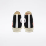 Rear view of CDG Play Converse High Top Black sneakers showing heel pull tabs, Converse branding, and premium black canvas construction.