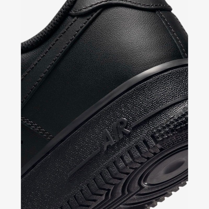 Nike Air Force 1 Low Black midsole detail showing AIR branding and textured rubber construction.