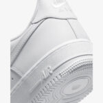 Close-up of Nike Air Force 1 Low Triple White midsole with AIR branding, textured rubber, and classic traction detail.