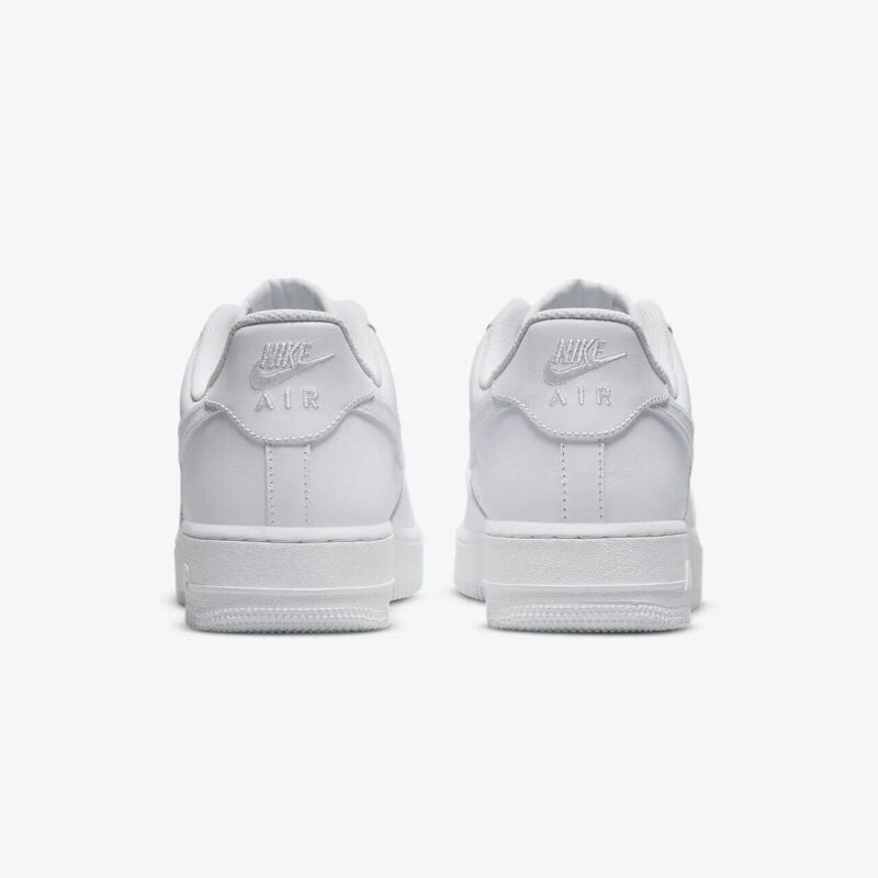 Rear view of Nike Air Force 1 Low Triple White with embroidered Nike Air heel branding and white leather panels.