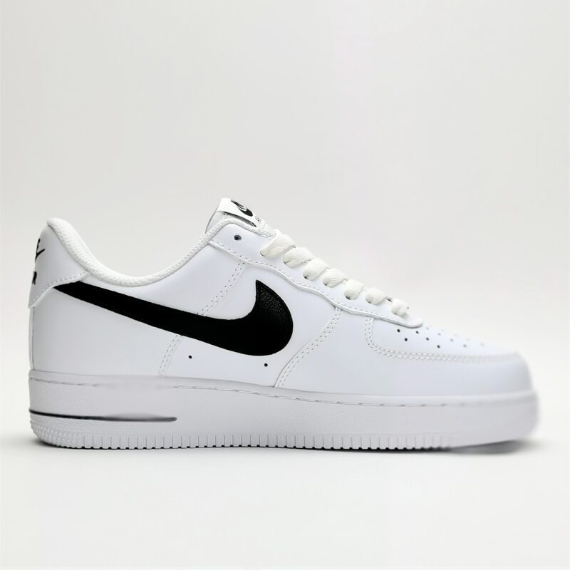 Medial side view of Nike Air Force 1 Low White Black CJ0952-100 showing smooth white leather panels and black Swoosh detailing.