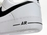 Close-up of Nike Air Force 1 Low White Black CJ0952-100 midsole with AIR branding and textured rubber outsole.