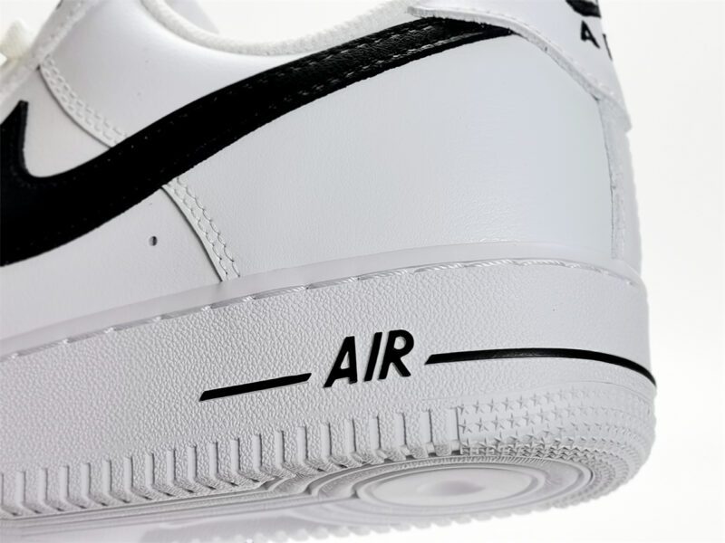 Close-up of Nike Air Force 1 Low White Black CJ0952-100 midsole with AIR branding and textured rubber outsole.