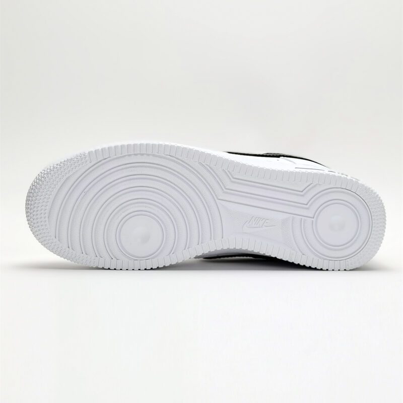 Outsole of Nike Air Force 1 Low White Black CJ0952-100 featuring the iconic circular traction pattern and durable rubber construction.