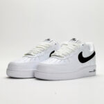 Nike Air Force 1 Low White Black CJ0952-100 sneakers featuring a white leather upper, black Swoosh logo, classic Air Force 1 silhouette, and cushioned sole.