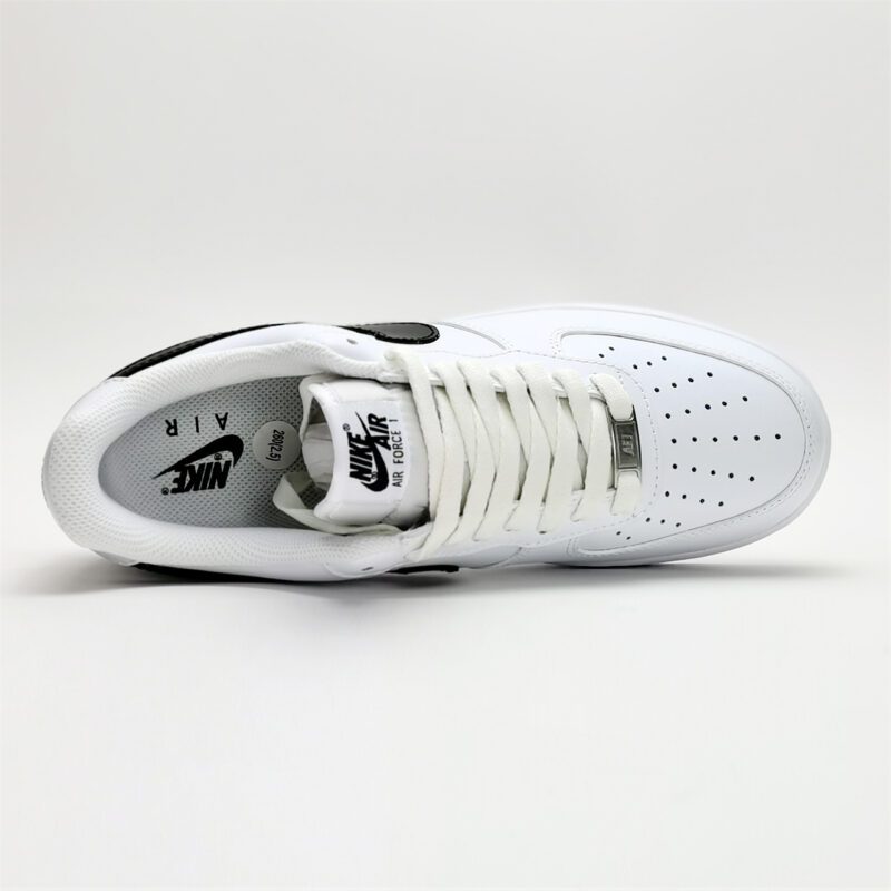 Top-down view of Nike Air Force 1 Low White Black CJ0952-100 featuring perforated toe box, white laces, and Nike Air tongue branding.