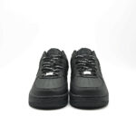 Front view of Supreme AF1 Black featuring perforated toe box, Supreme branded black laces and premium leather upper.