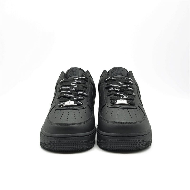 Front view of Supreme AF1 Black featuring perforated toe box, Supreme branded black laces and premium leather upper.