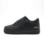 Side profile of Supreme Air Force 1 Low Black showing tonal black Nike Swoosh, Supreme Box Logo branding and all black Air Force 1 midsole.