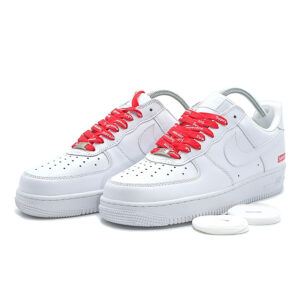 Supreme x Nike Air Force 1 Low White sneakers featuring premium white leather upper and red Supreme branded laces