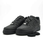 Supreme x Nike Air Force 1 Low Black sneaker featuring premium black leather upper, Supreme branded laces, Nike Air cushioning and iconic black Air Force 1 silhouette.