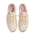 Top view of the Travis Scott Air Jordan 1 Low Shy Pink showing cream leather panels, pink accents, Cactus Jack branding, and signature sneaker details.