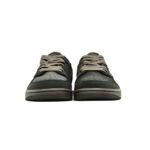 Front-facing view of Travis Scott Air Jordan 1 Low Velvet Brown with dark brown suede toe box, matching laces, and low-top Air Jordan silhouette.