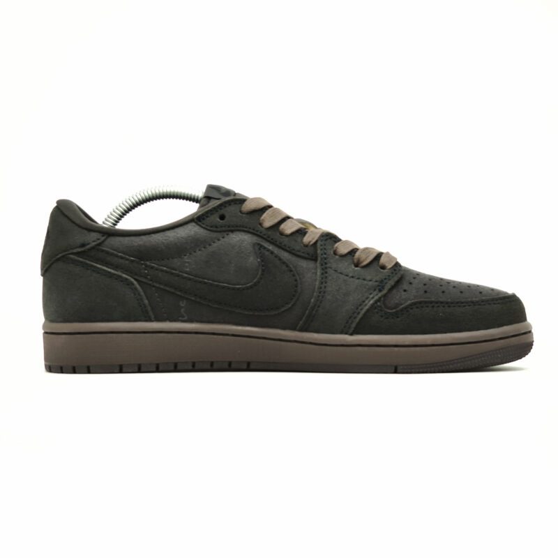 Medial side profile of Travis Scott Air Jordan 1 Low Velvet Brown displaying hidden Cactus Jack branding and premium suede overlays.