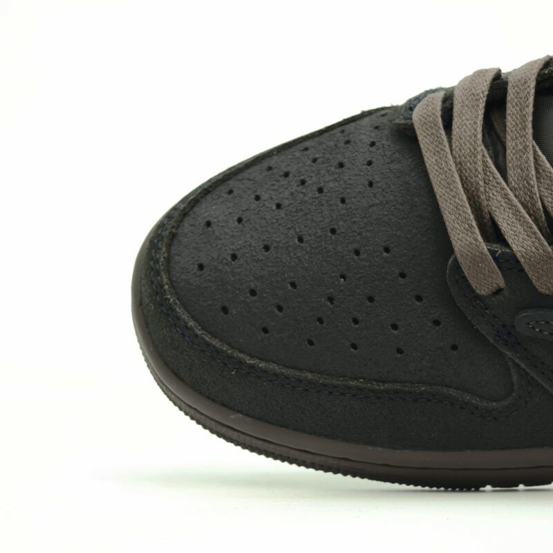 Close-up of the suede toe box on the Travis Scott Air Jordan 1 Low Velvet Brown showing texture, perforations, and premium craftsmanship.