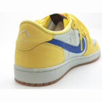 Close-up of Travis Scott Jordan 1 Low Canary heel featuring embroidered Cactus Jack face logo.