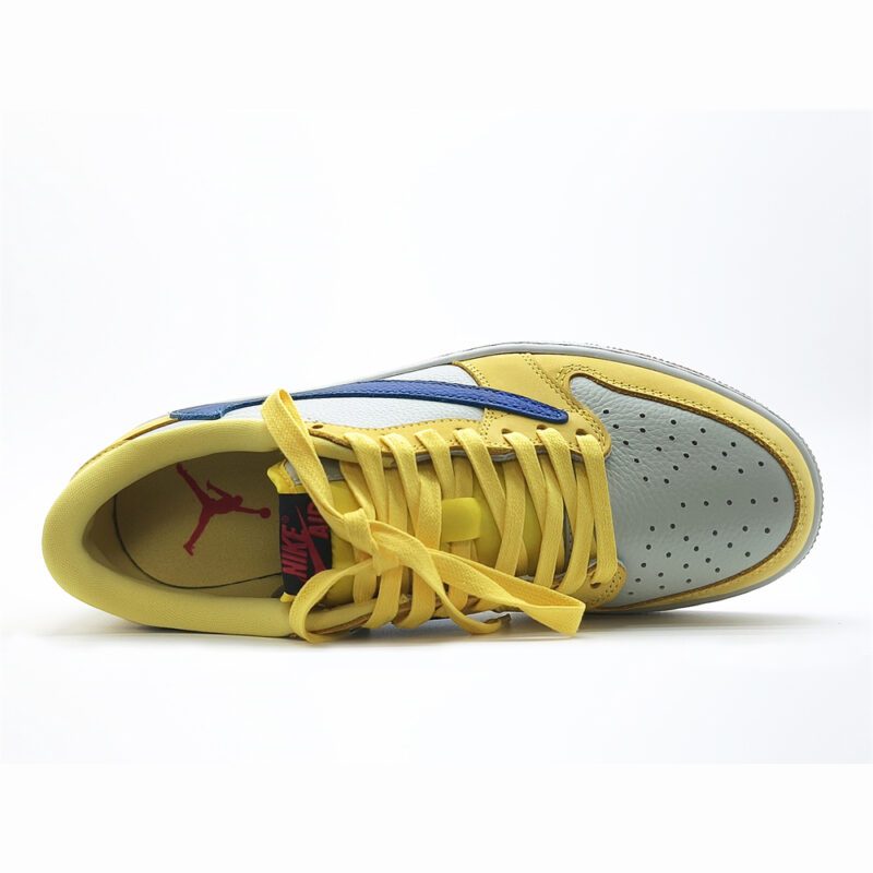 Close-up top view of Travis Scott Jordan 1 Low Canary showing yellow laces and white perforated toe box.