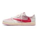 Side profile of Travis Scott Air Jordan 1 Low OG Tropical Pink showing the oversized reverse pink Swoosh and premium leather construction.