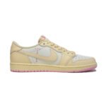 Medial side profile of the Travis Scott Air Jordan 1 Low Shy Pink featuring Cactus Jack branding, cream leather panels, and the standard Nike Swoosh.